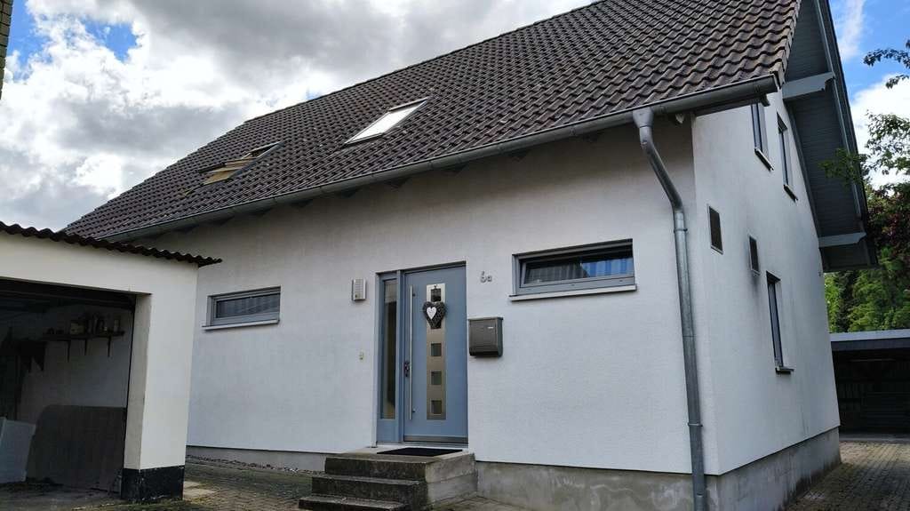 Immobilie in Lüerdissen - Familienfreundliches Einfamilienhaus mit großer Küche, Gartenhütte und Doppelcarport in Oelkassen - Bild 2