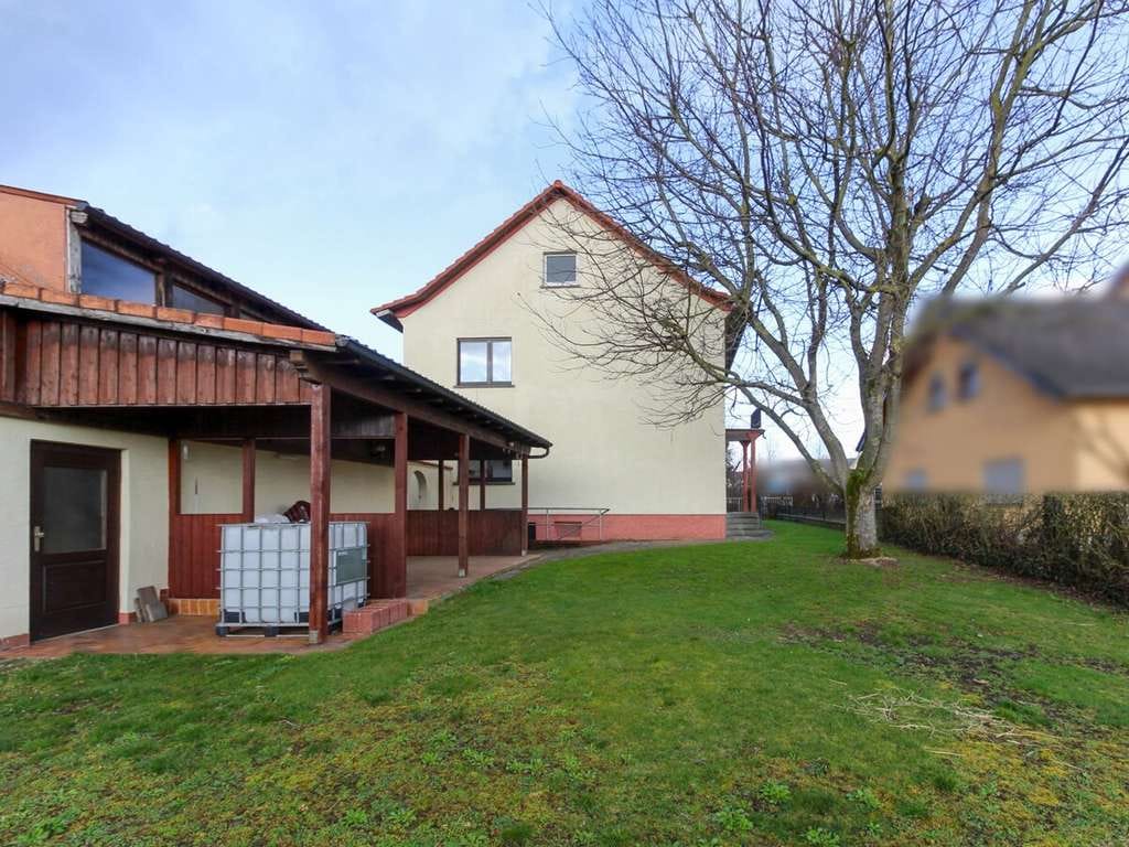 Immobilie in Neuhof - Zweifamilienhaus mit Garten und Doppelgarage in Neuhof- Hattenhof - Bild 1