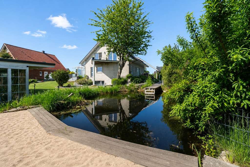 Immobilie in Langballig - Ringsberg: Einfamilienhaus mit Einliegerwohnung zum Ankommen, Durchatmen und Bleiben - Bild 0