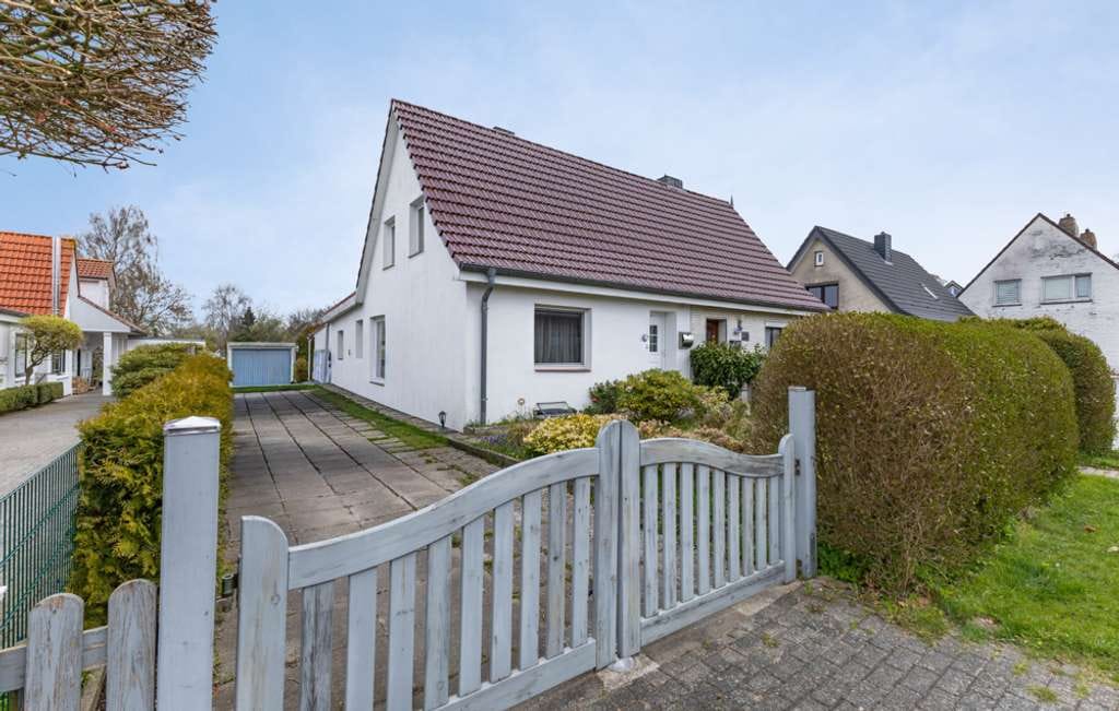 Immobilie in Groven - Solide Doppelhaushälfte mit weitläufigem Grundstück und Modernisierungspotenzial in Lunden - Bild 0
