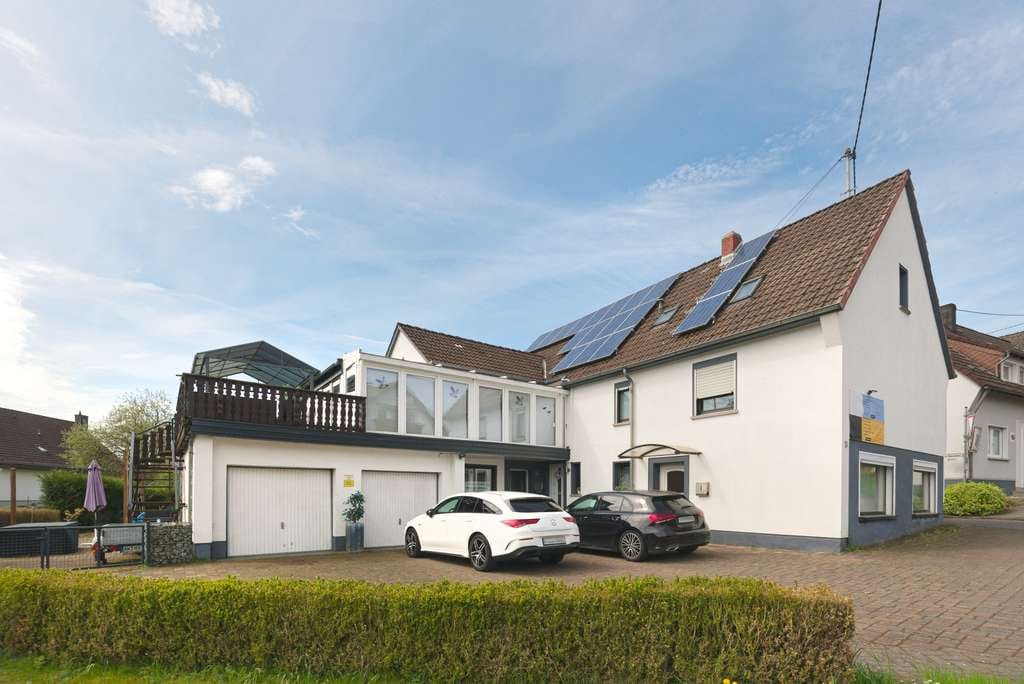 Immobilie in Obererbach - Modernisiertes Einfamilienhaus mit Einliegerwohnung und Wintergarten in Obererbach - Bild 0