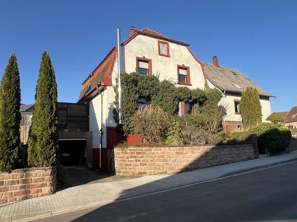 Immobilie in Heltersberg - Charmantes Einfamilienhaus mit Garage und einladender Terrasse - Bild 0