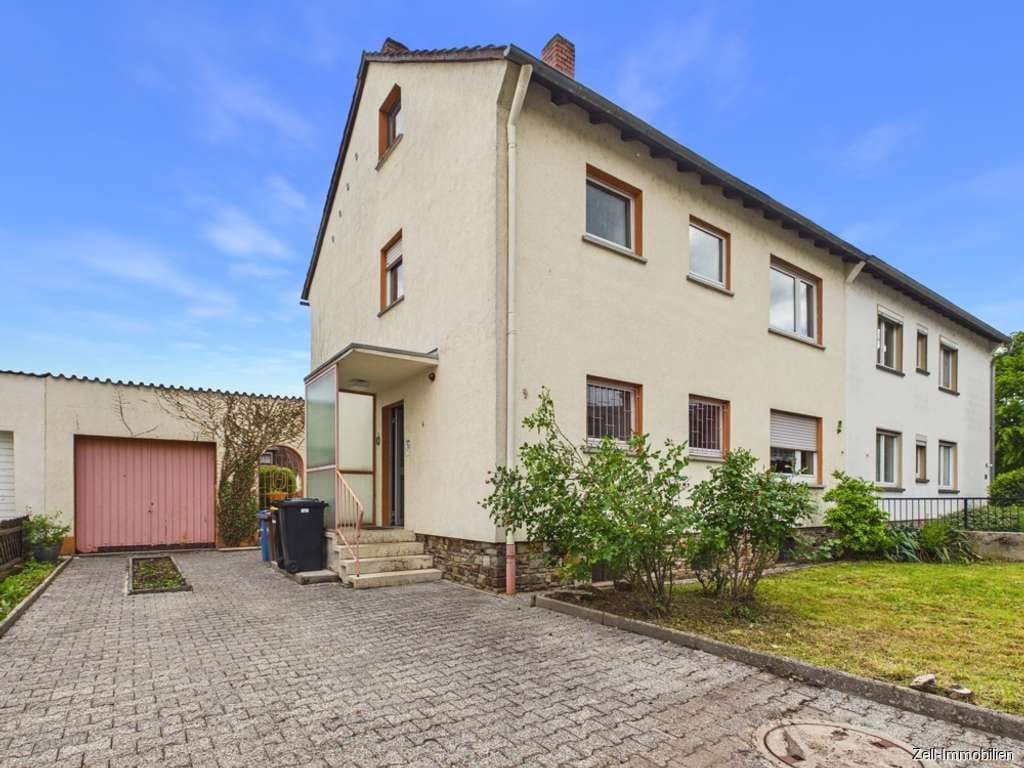 Immobilie in Rüdesheim am Rhein - Familienfreundliche Doppelhaushälfte mit Garten, Terrasse und Garage - Bild 0
