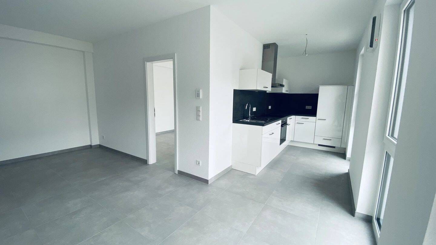 Immobilie in Tawern - Kapitalanlage mit Zukunft: Moderne 2-Zimmer-Wohnung mit Terrasse, Garten & optionalem Stellplatz in Tawern - Bild 0