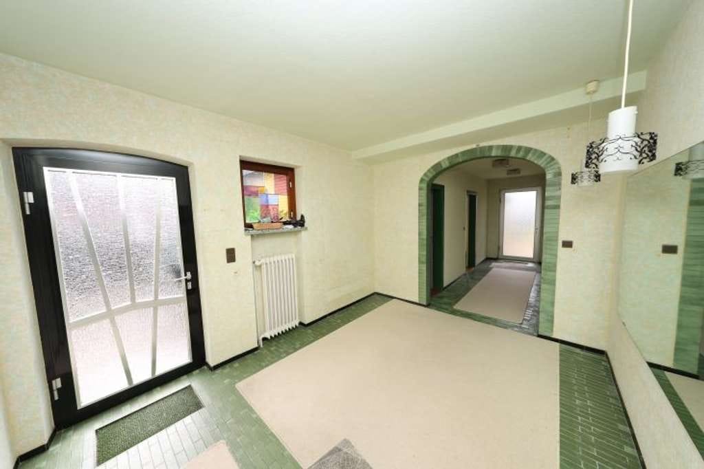 Immobilie in Heide - Großzügiges Einfamilienhaus mit massiver Garage in ruhiger Seitenstraßenlage im "alten Heide-Ost" - Bild 4