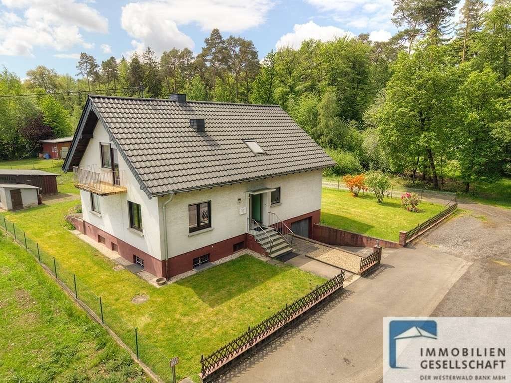 Immobilie in Dürrholz - Geräumiges Zweifamilienhaus in einzigartiger Waldrandlage von Dürrholz-Muscheid! - Bild 0