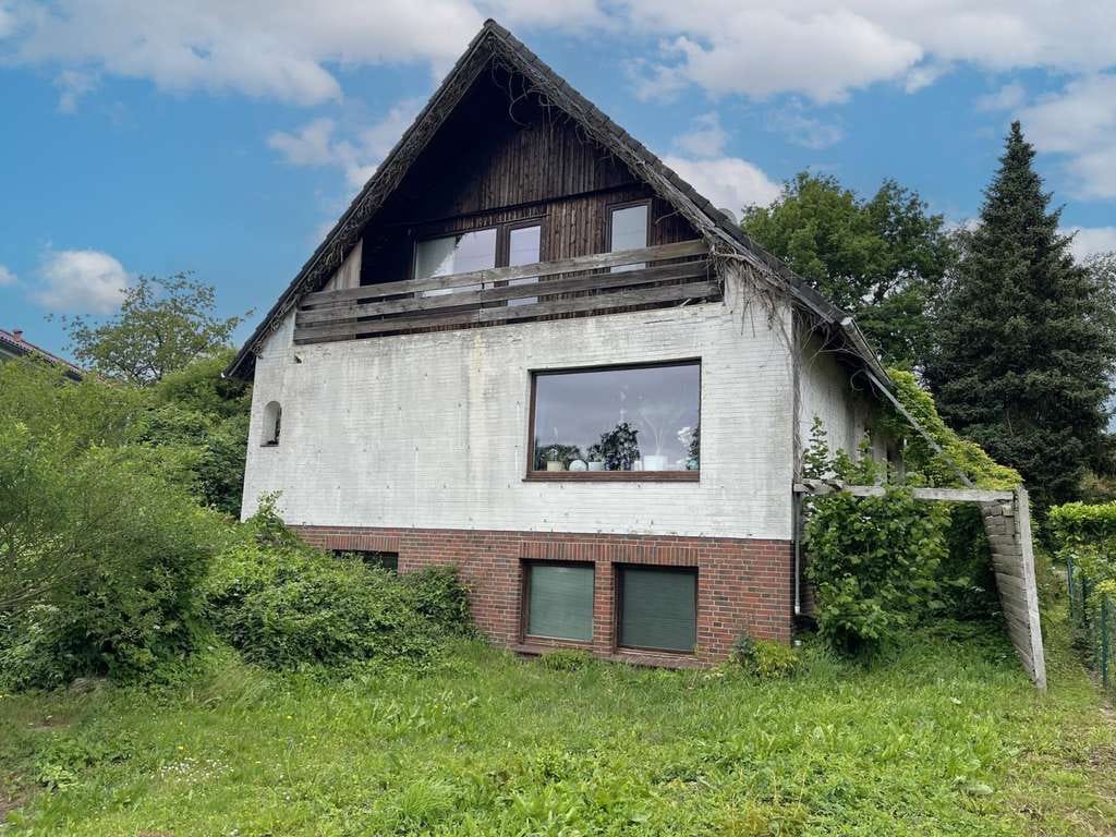 Immobilie in Molfsee - Vermietetes, sanierungsbedürftiges EFH mit ELW im beliebten Molfsee - Bild 1