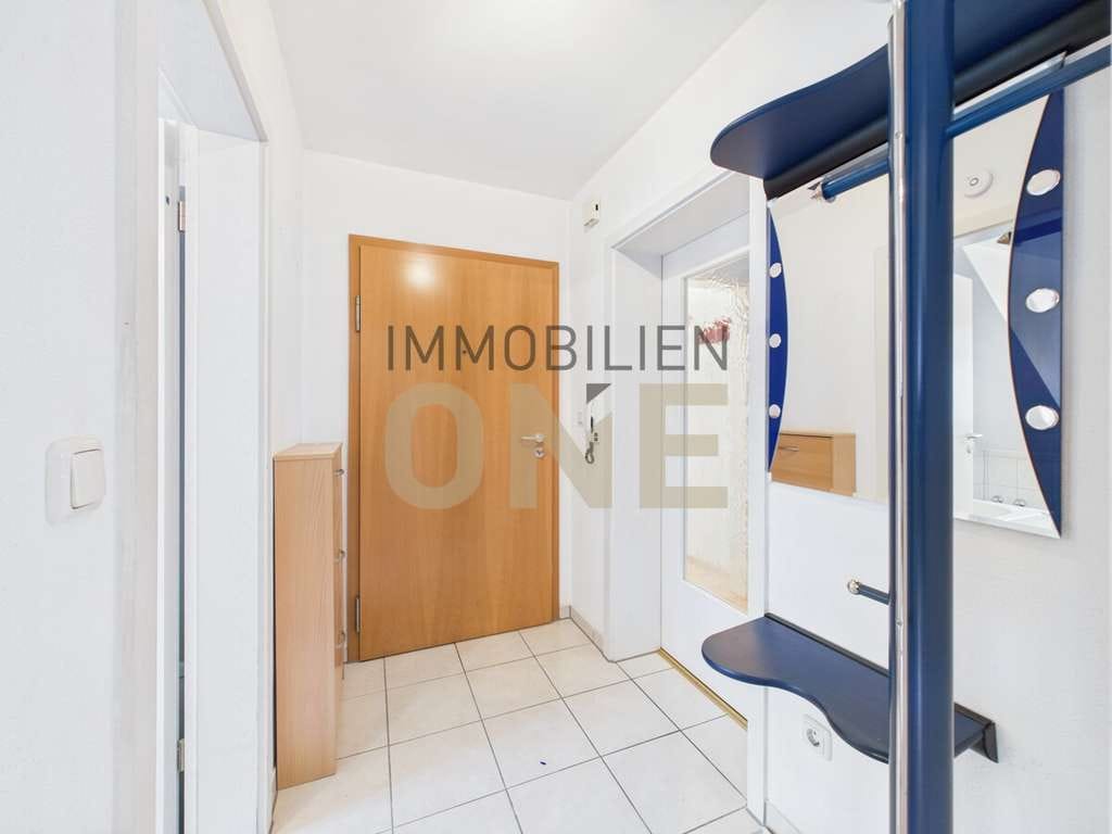Immobilie in Nittendorf - Helle 2,5-Zimmer Galeriewohnung mit Balkon und Tiefgaragenstellplatz - Bild 1