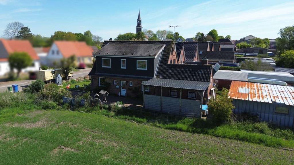 Immobilie in Groven - Wohnen in Eidernähe! Massiv gebautes EFH mit Blick  auf die Dithmarscher Marschlandschaft - Bild 0