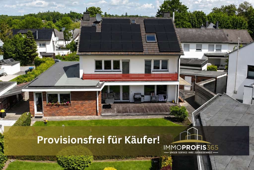 Immobilie in Warstein - Viel Platz für Familie, Wohnen und Arbeiten: Zweifamilienhaus mit PV-Anlage, Garage und Halle - Bild 0