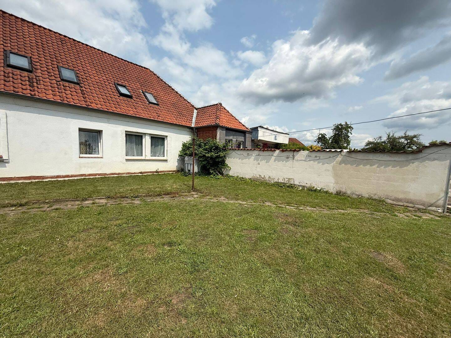 Immobilie in Heemsen - Gepflegtes Mehrfamilienhaus mit 7 Wohneinheiten & optionalem Baugrundstück in Heemsen - Bild 4
