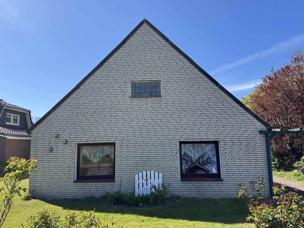Immobilie in Wurster Nordseeküste - Siedlungshaus mit Anbau und 2 Garagen - Bild 1
