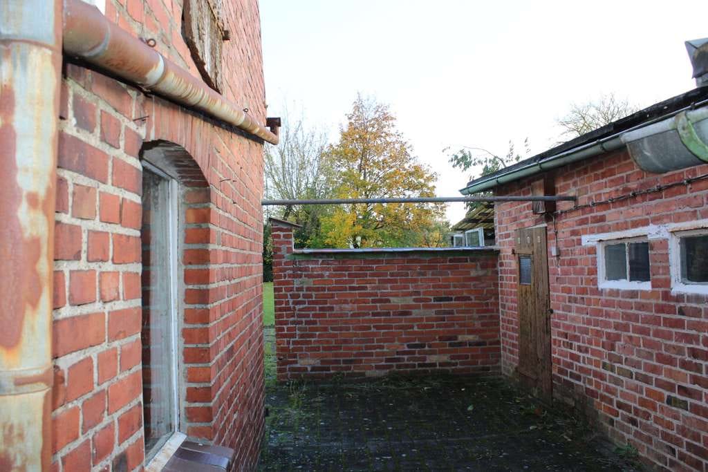Immobilie in Grimmen - Familienfreundliches Mehrfamilienhaus mit Nebengelass und großem Grundstück - Bild 1