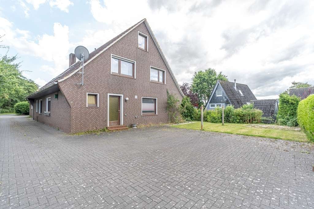 Immobilie in Wangerland - Chamantes Einfamilienhaus mit Einliegerwohnung und Garage in ruhiger Lage von Carolinensiel - Bild 1