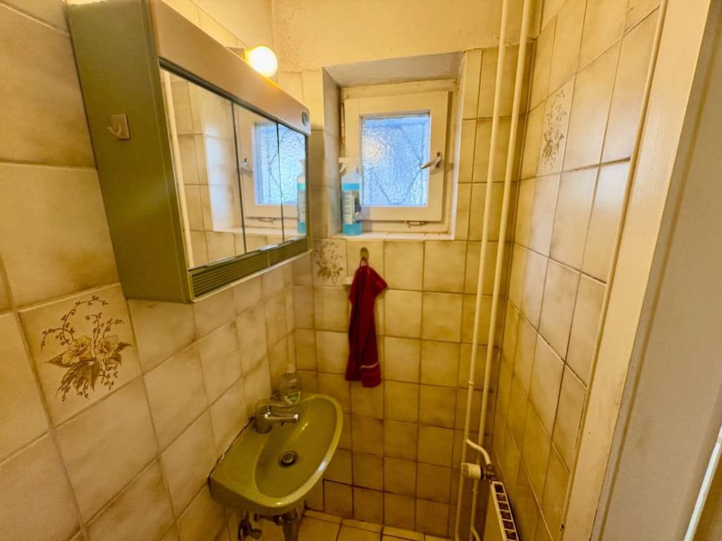 Immobilie in Nienburg/Weser - Reihenmittelhaus mit Balkon, Terrasse und Garten in Langendamm – ideal für Familien! - Bild 1
