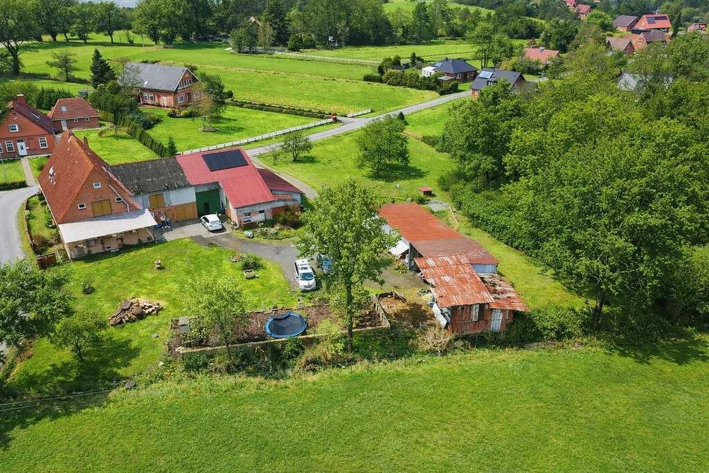 Immobilie in Neuenkirchen - Ländliche Idylle mit Wasserzugang: Charmanter Resthof mit Ferienwohnung und weitläufigem Grundstück - Bild 1