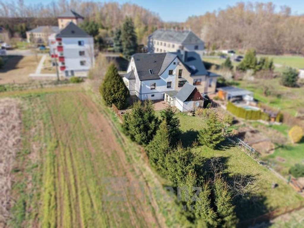 Immobilie in Oelsnitz/Erzgeb. - Doppelhaushälfte in Oelsnitz/Erzgeb. kaufen: 124 m² Wohnfläche, schöner Garten, Garage und Keller - Bild 1
