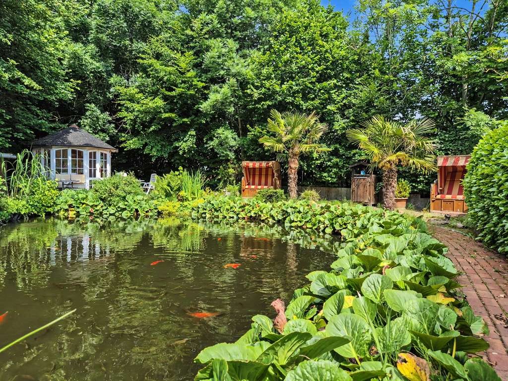 Immobilie in Sterup - Vielseitiges Wohnhaus mit drei Wohnungen, Fernwärme und idyllischem Teichgarten in Sterup - Bild 4