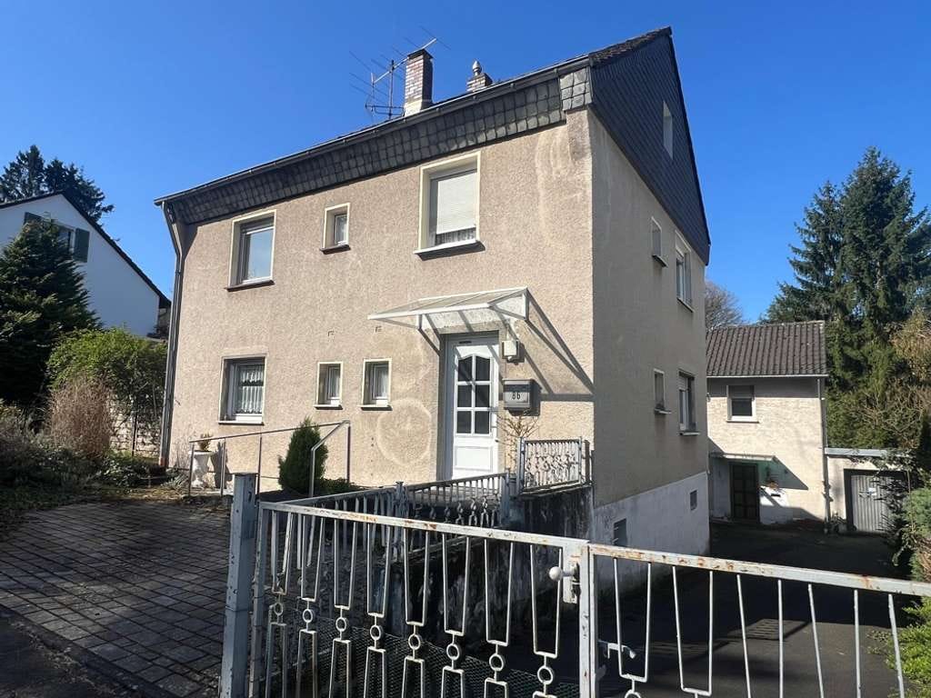 Immobilie in Königswinter - Kompaktes Einfamilienhaus mit kleinem Garten und Garage in ruhiger Lage von Heisterbacherrott - Bild 0