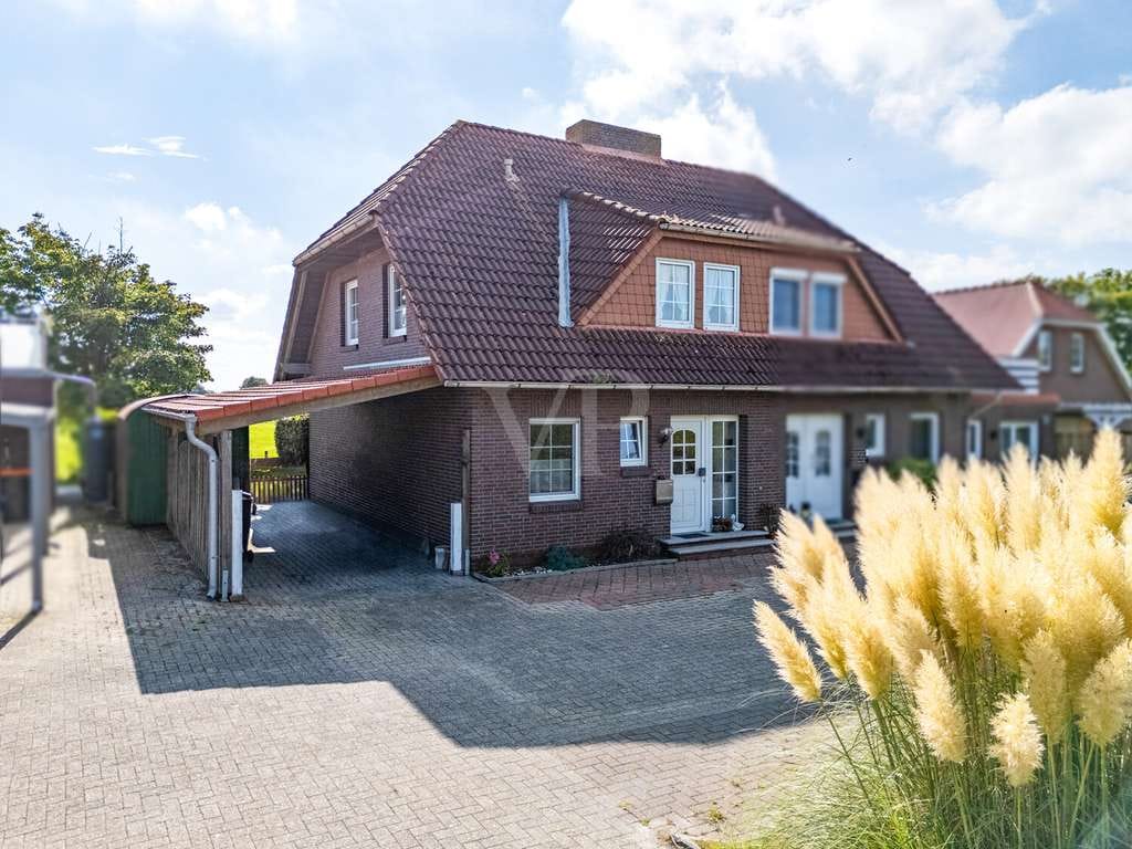 Immobilie in Holtgast - Leben im Grünen - Charmante vermietete Eigentumswohnung/Doppelhaushälfte am Feldrand von Utgast - Bild 1