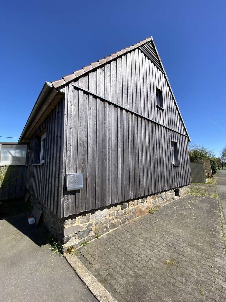 Immobilie in Ulrichstein - Ruheoase - herrlich gelegenes Einfamilienhaus mit Scheune und Garten - Bild 1