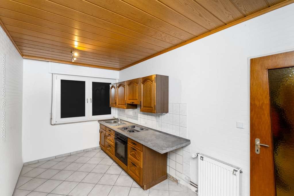 Immobilie in Langen - Vielseitiges Renditeobjekt: Gepflegtes Mehrgenerationenhaus mit drei Wohneinheiten und Ausbaureserve - Bild 3