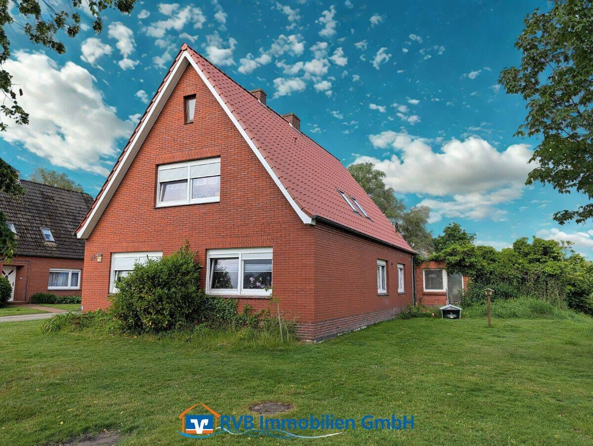 Immobilie in Neukamperfehn - Handwerker aufgepasst - vermietetes Einfamilienhaus mit unverbautem Blick - Bild 1