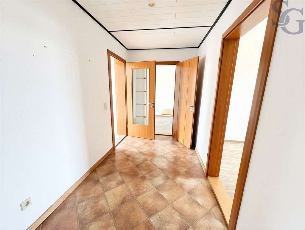 Immobilie in Leisnig - Einmalige Gelegenheit! Bezugsfertige Wohnung mit Dachgeschossrohling zum Ausbau - Bild 4