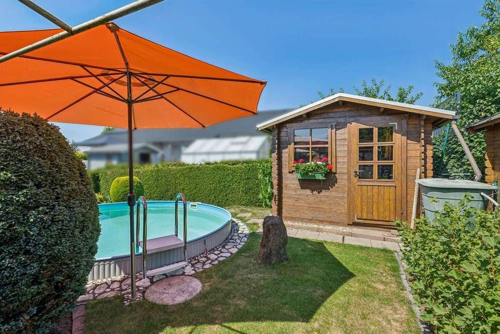 Immobilie in Pohlheim - Gepflegte Doppelhaushälfte in ruhiger Feldrandlage mit Pool und Garten - Bild 5