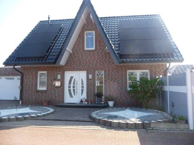 Immobilie in Badbergen - Gepflegtes Einfamilienhaus mit 1 Doppelgarage und 1 PV-Anlage in 49635 Badbergen - Bild 1