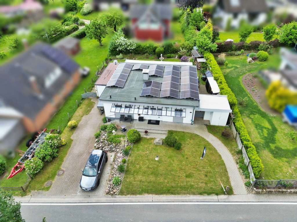 Immobilie in Steinbergkirche - Nur wenige Schritte zum Meer: Bungalow mit Garten, Wintergarten, PV, Terrasse & befrist. Wohnrecht. - Bild 1