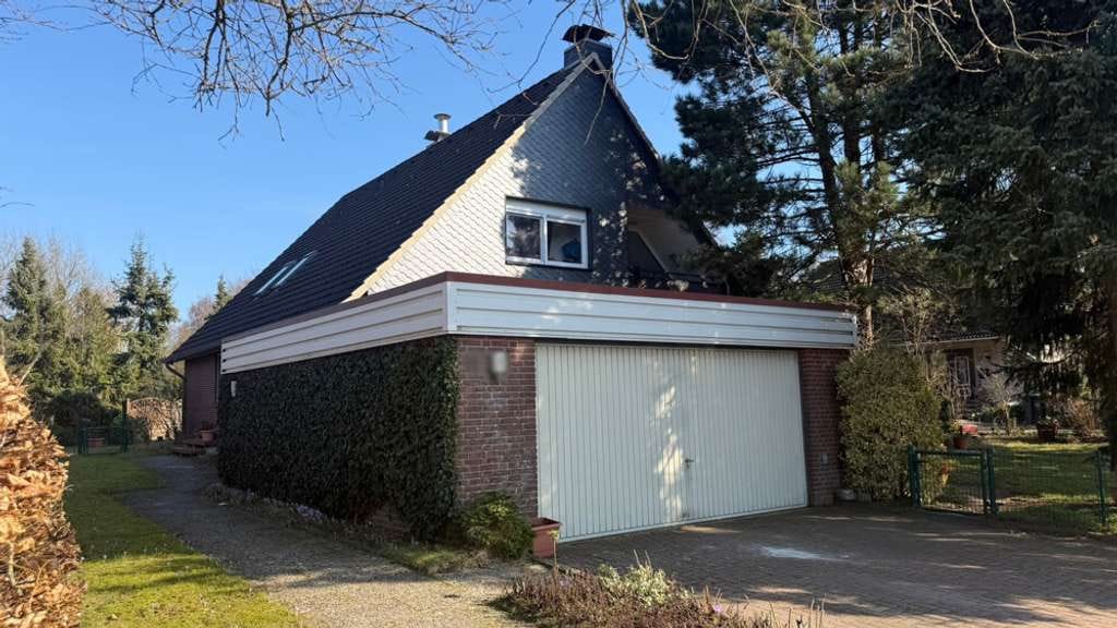 Immobilie in Warder - Einfamilienhaus mit Einliegerwohnung und Doppelgarage in ruhiger Wohnlage von Warder - Bild 1