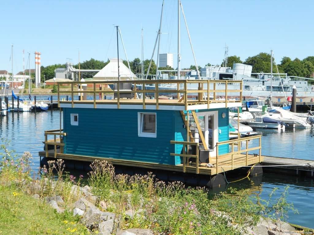 Immobilie in Neustadt in Holstein - Schmuckes Hausboot an der Ostsee mit sehr guter Rendite - Bild 1