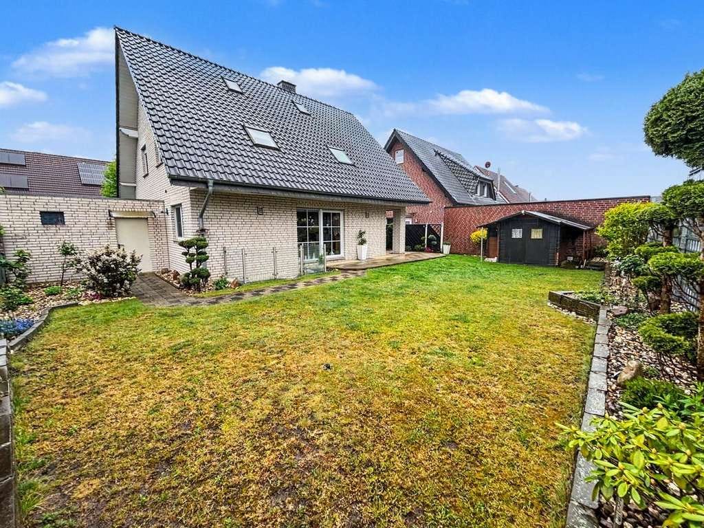 Immobilie in Reken - Familienfreundliches Einfamilienhaus mit Garten und Garage in ruhiger Lage von Reken - Bild 1