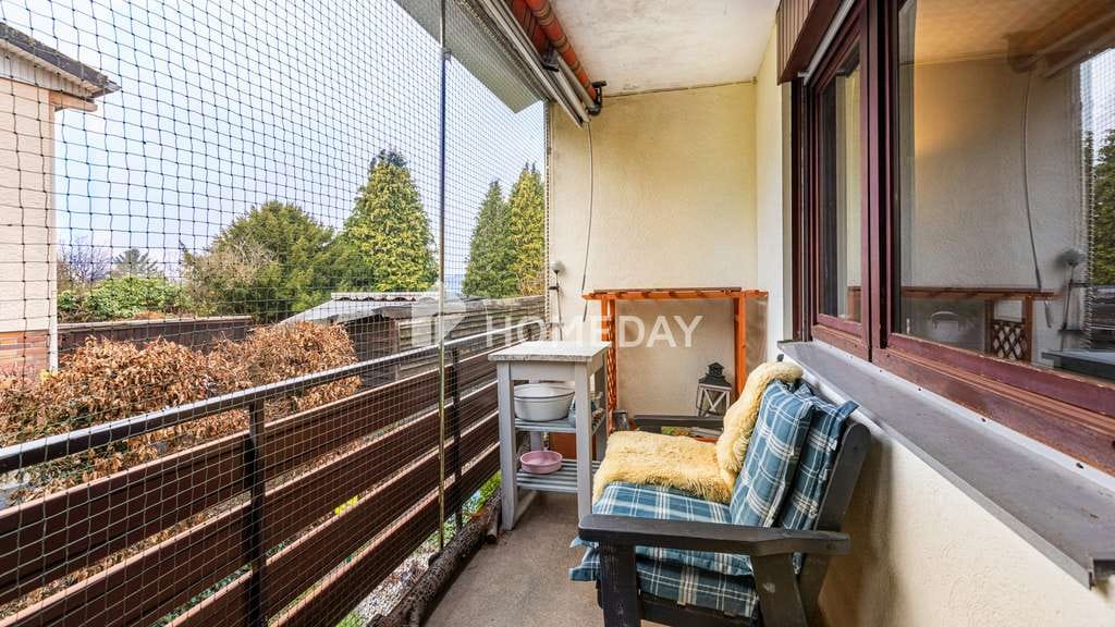 Immobilie in Hirzenhain - 2-Zimmer-Erdgeschosswohnung mit Südwestbalkon in ruhiger Lage von Hirzenhain - Bild 1