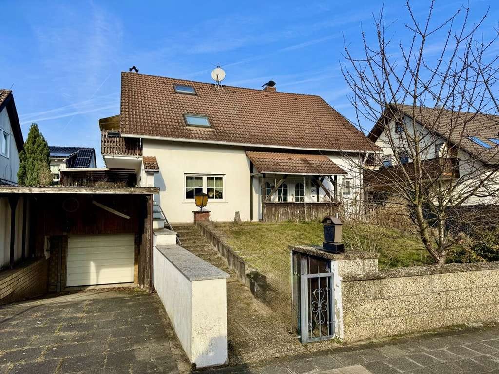 Immobilie in Münster (Hessen) - Freistehendes Einfamilienhaus mit
Einliegerwohnung, Garage & großer Terrasse - Bild 0
