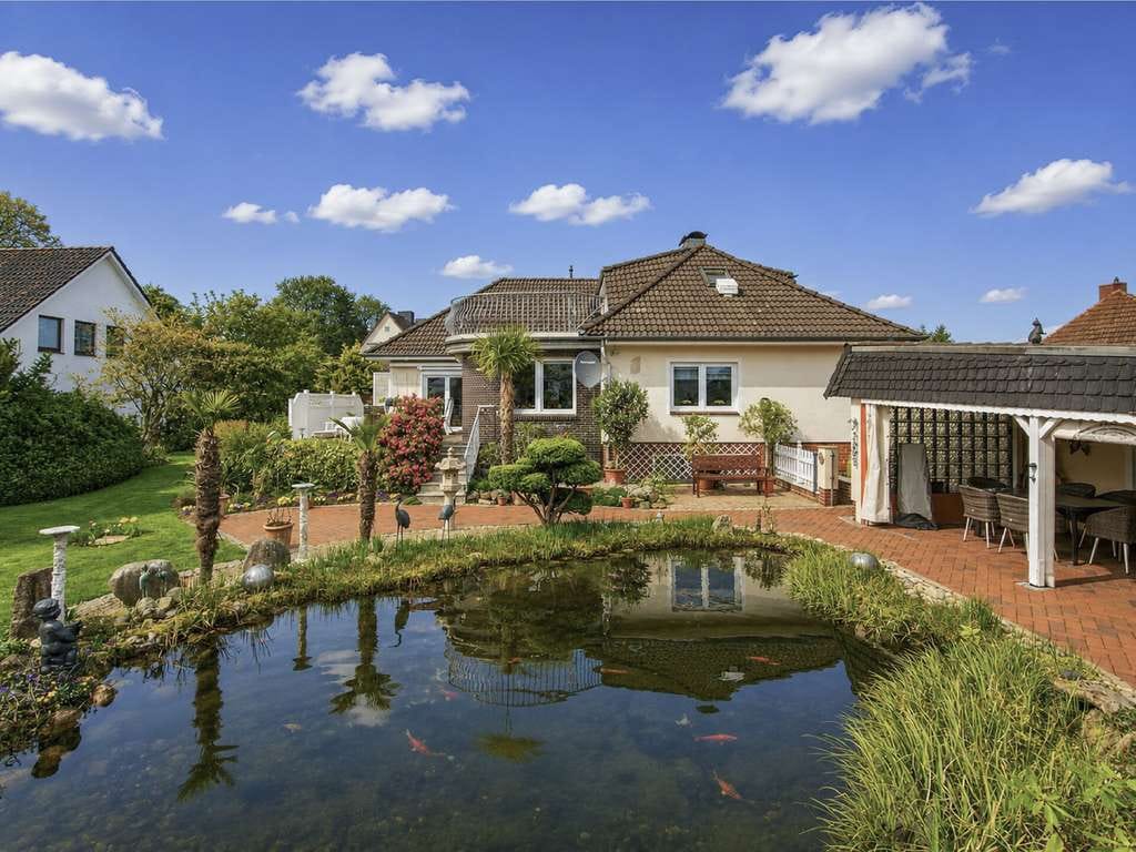 Immobilie in Hohenlockstedt - Zwischen Gartenidylle und Wohnkomfort – Großzügiges Ein-/Zweifamilienhaus auf 1.176 m² Traumgrundstü - Bild 1