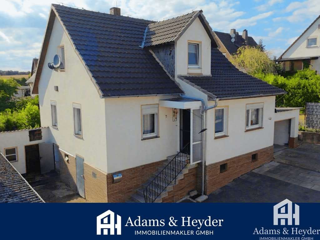 Immobilie in Fritzlar - Familienfreundliches Einfamilienhaus mit Garage, Garten und ausgebautem Dachgeschoss - Bild 0