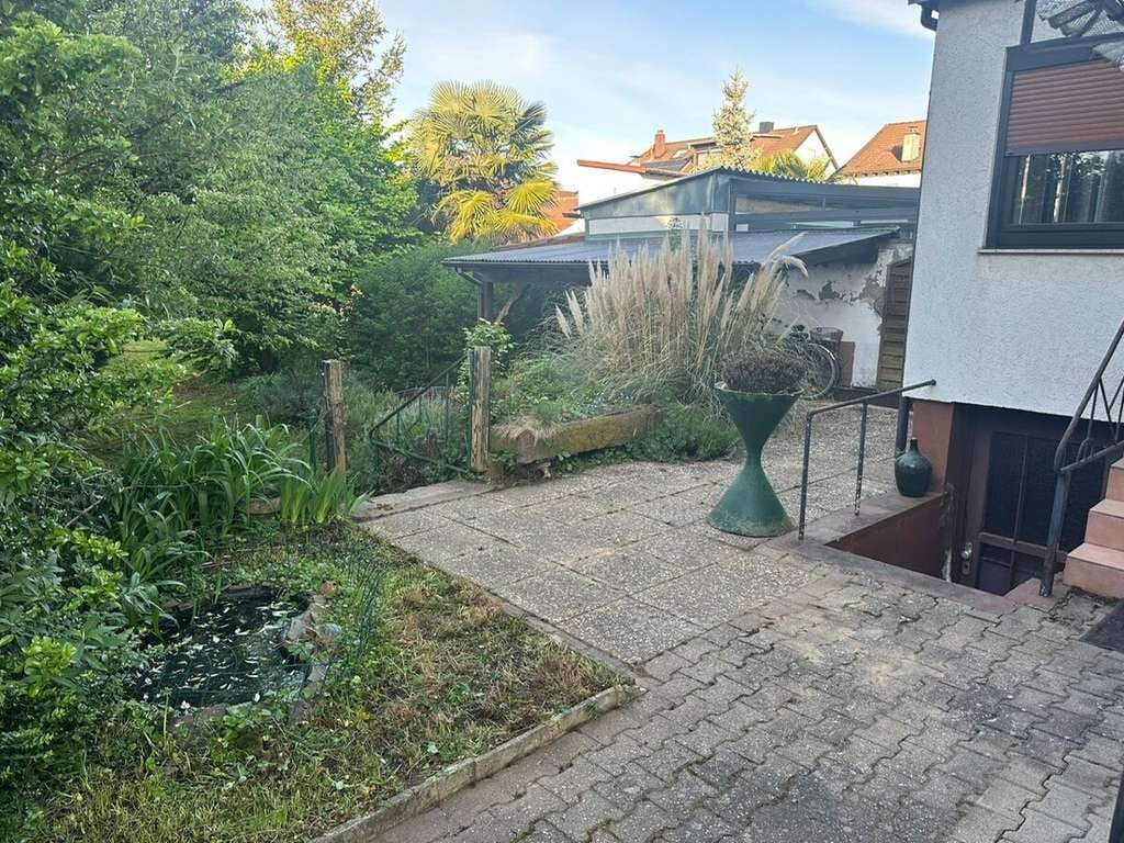 Immobilie in Oftersheim - Platz für Familie & Zukunft: Zweifamilienhaus mit tollem Garten und Ausbaupotenzial - Bild 1
