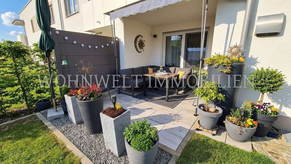 Immobilie in Neufahrn in Niederbayern - Helle, barrierefreie 2-Zi.-EG-Wohnung mit gepflegtem Garten - Bild 0