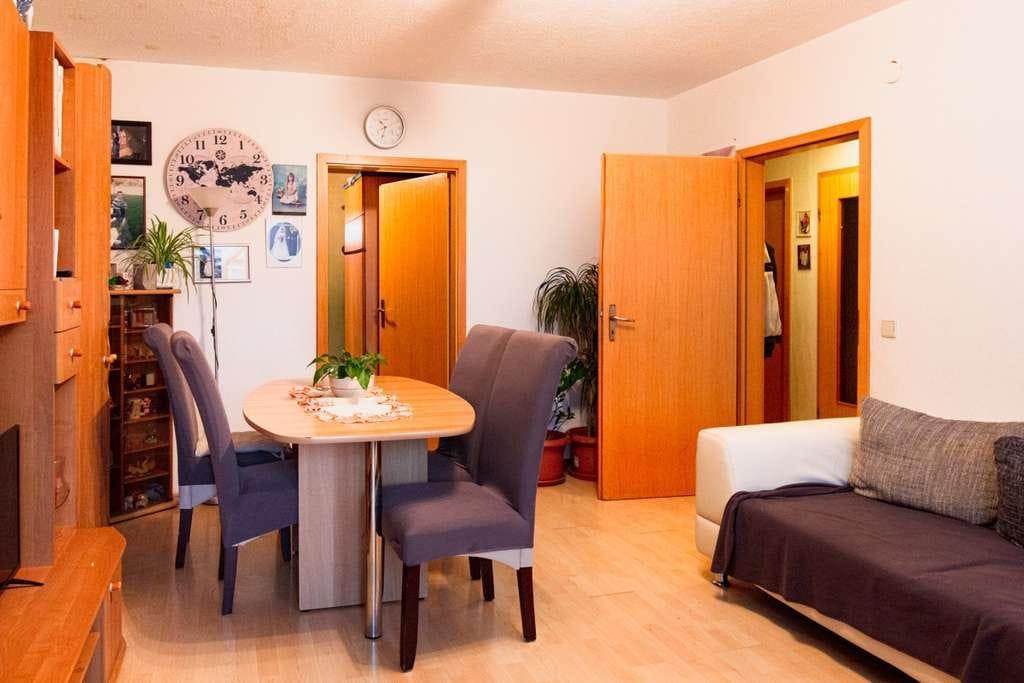 Immobilie in Auggen - Angebautes Einfamilienhaus mit Renovationsbedarf in Auggen - Bild 1