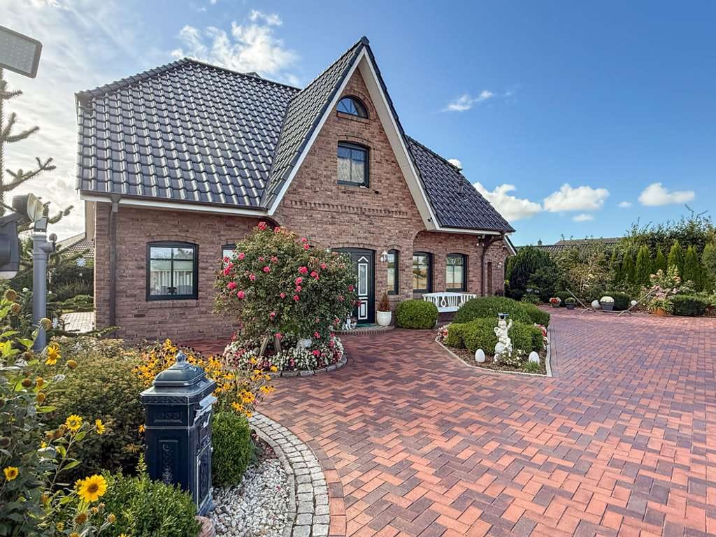 Immobilie in Epenwöhrden - Typisch friesisch, top-gepflegt, viel Platz: modernes Einfamilienhaus in der Nähe von Heide. - Bild 1