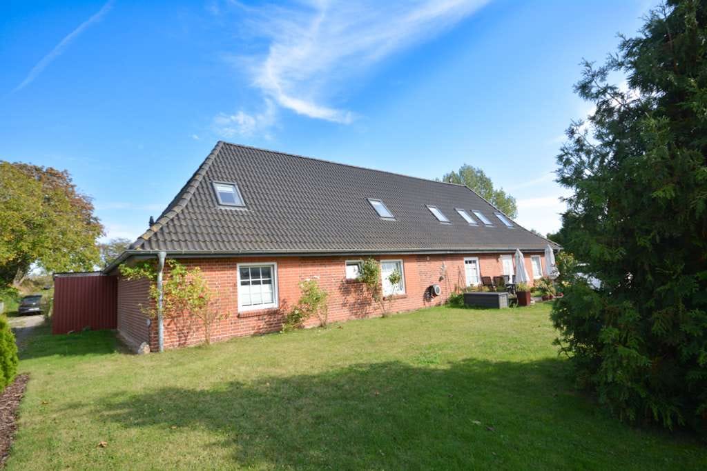 Immobilie in Lensahn - Dreifamilienhaus mit Großgarage, Nebengebäude und großem Grundstück - Bild 4