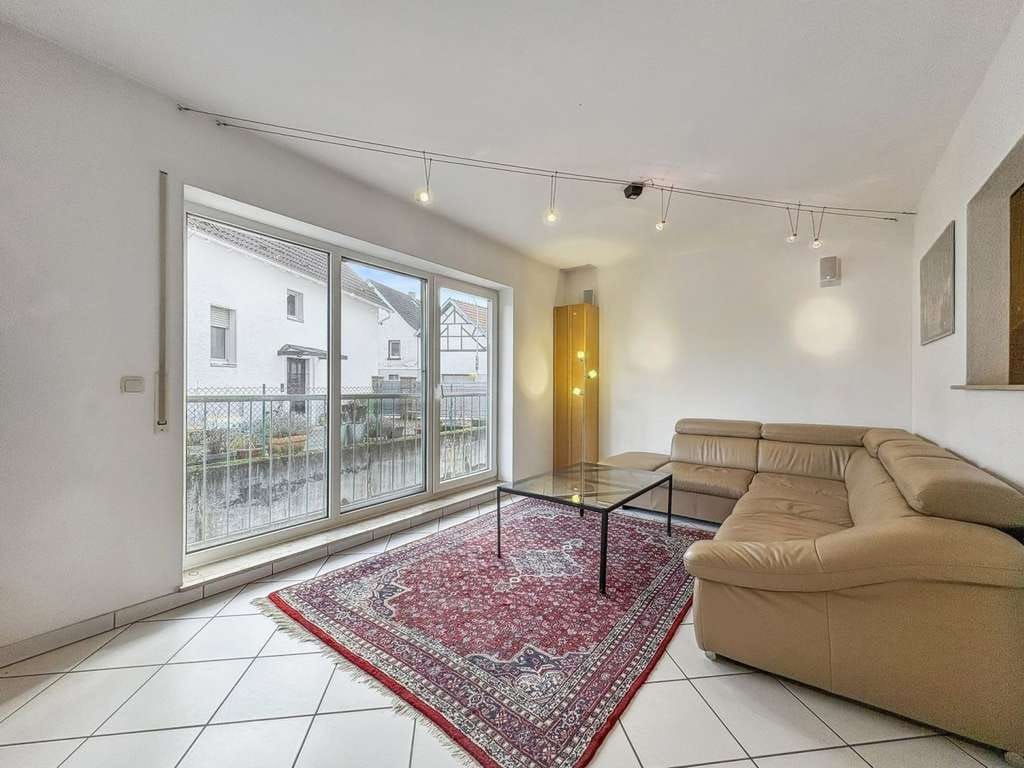 Immobilie in Ober-Ramstadt - Ober-Ramstadt: Gepflegte 2-Zimmer-Wohnung mit Tiefgaragenstellplatz und ruhigem Gemeinschaftsgarten - Bild 1