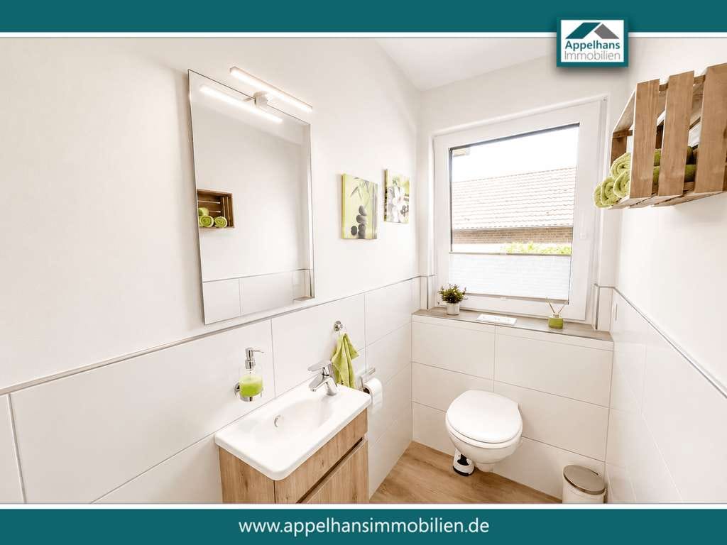 Immobilie in Bippen - Modernisiertes Zweifamilienhaus mit zwei Wohneinheiten, Wintergarten, Kamin und großzügigem Garten - Bild 3