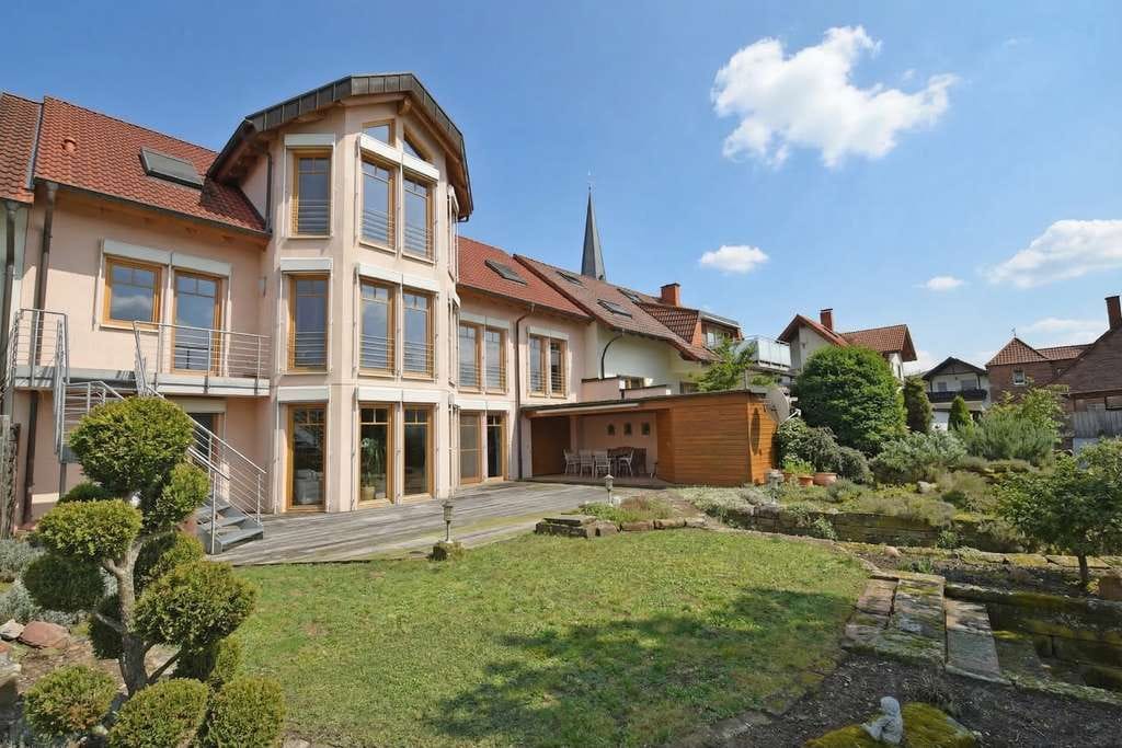 Immobilie in Großheubach - Ein Zuhause für Generationen – Wohnen & Vermieten in bester Mainlage - Bild 0