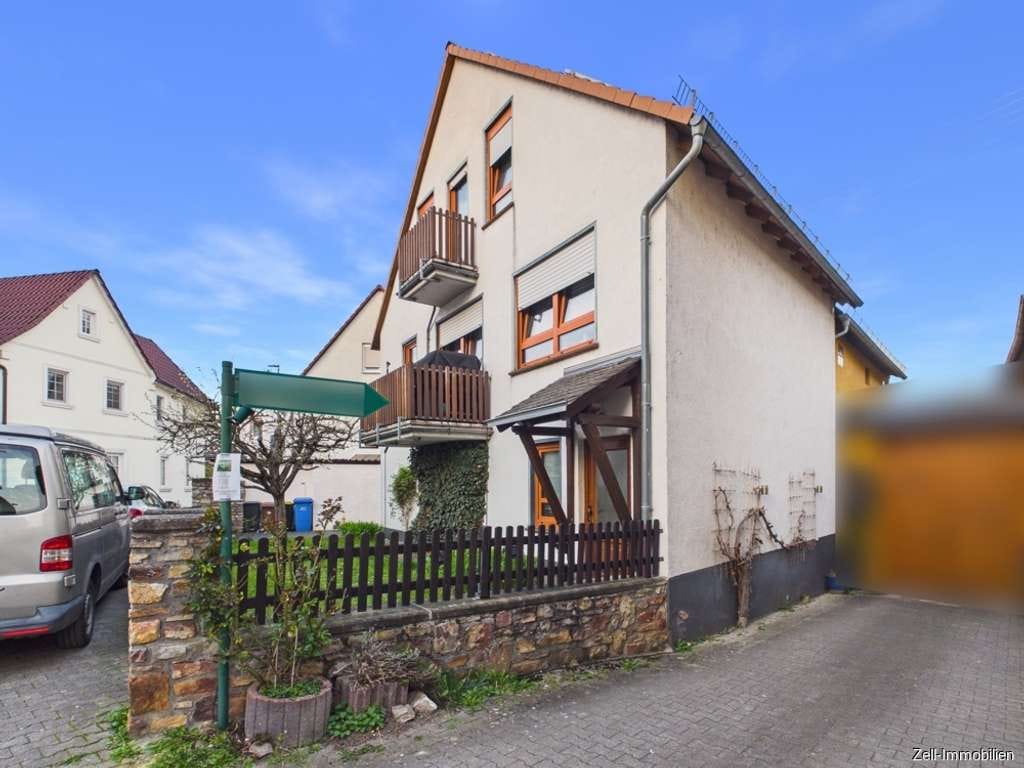 Immobilie in Oestrich-Winkel - Tolles Einfamilienhaus mit separater Wohnung im Anbau und Garage in zentraler Lage von Oestrich - Bild 1