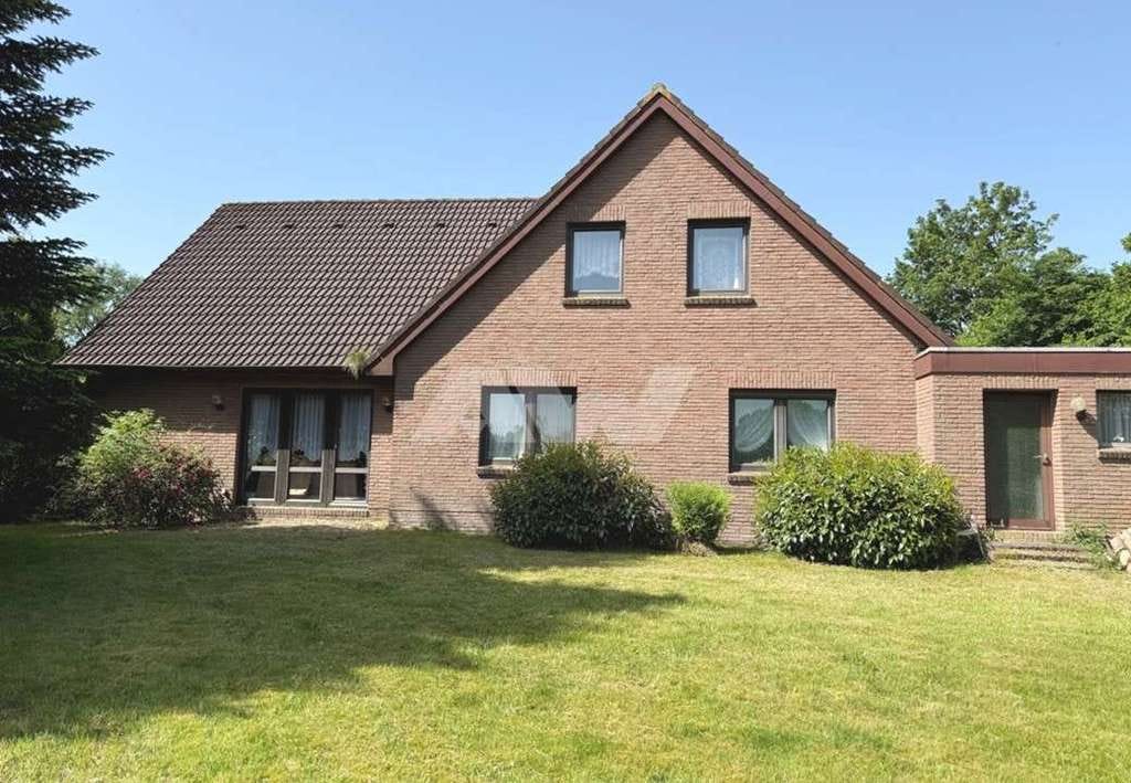 Immobilie in Großheide - Zweifamilienhaus mit Garage in Großheide-Südcoldinne - Bild 1
