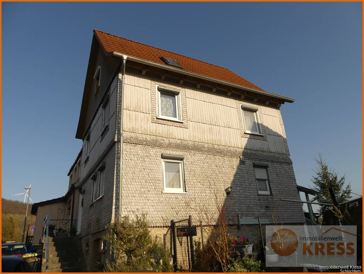 Immobilie in Schlüchtern - DHH mit kleinem Garten, zwei PKW-Stellplätzen, sonnigem Balkon und ruhiger Lage in Elm. - Bild 0
