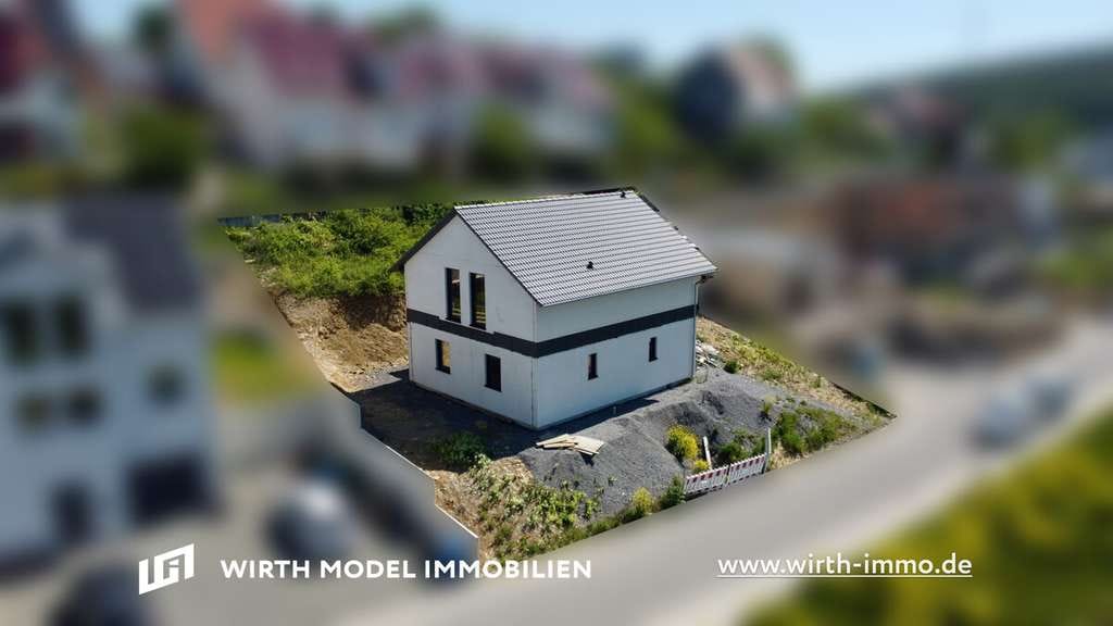 Immobilie in Maßbach - Freistehendes Einfamilienhaus zur individuellen Fertigstellung mit Grundstück in Hanglage - Bild 0